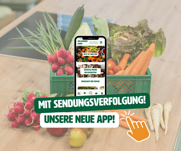 KI generiert: Ein Korb mit Gemüse und ein Smartphone; Text: "MIT SENDUNGSVERFOLGUNG! UNSERE NEUE APP!"