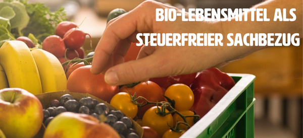 Hand greift in Obstkiste